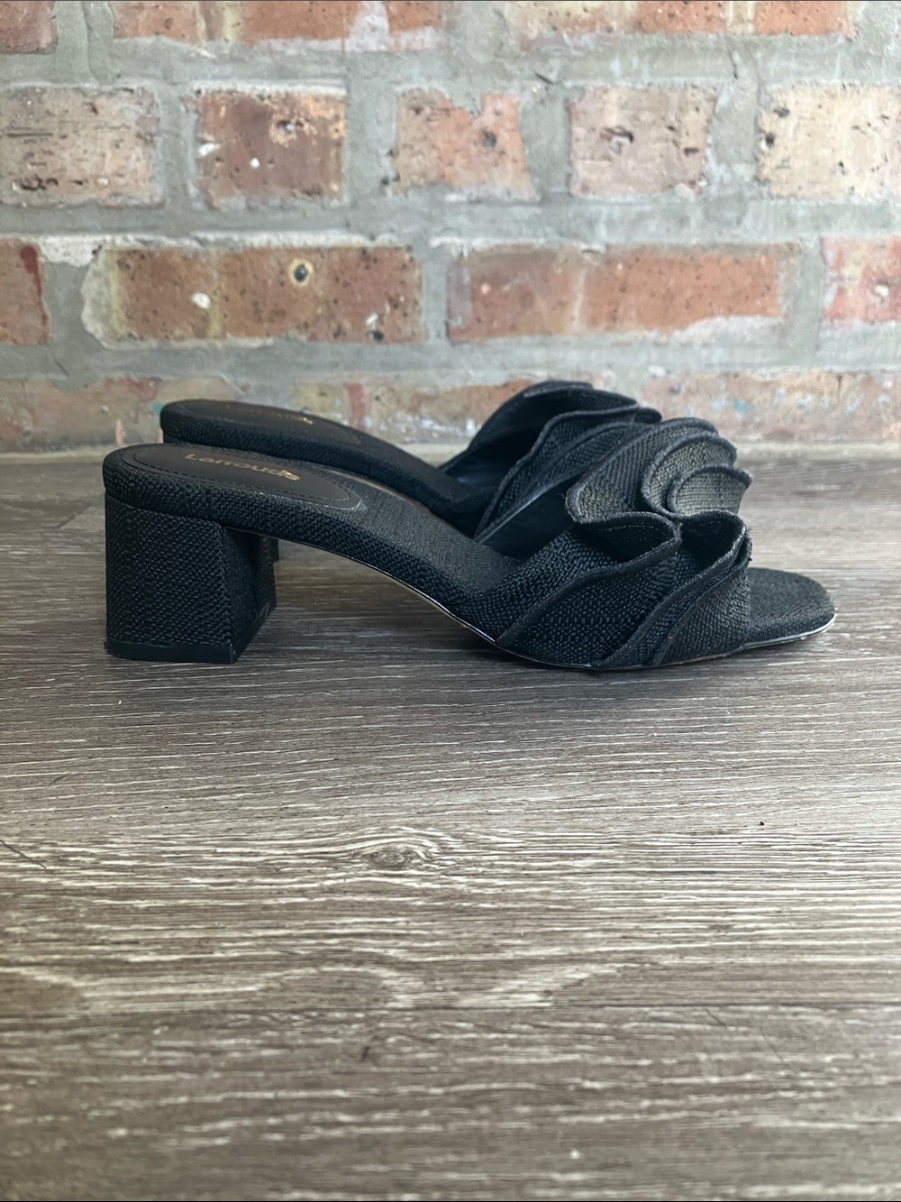 Larroudé Brigitte ruffle mules featuring a raffia texture and a block heel